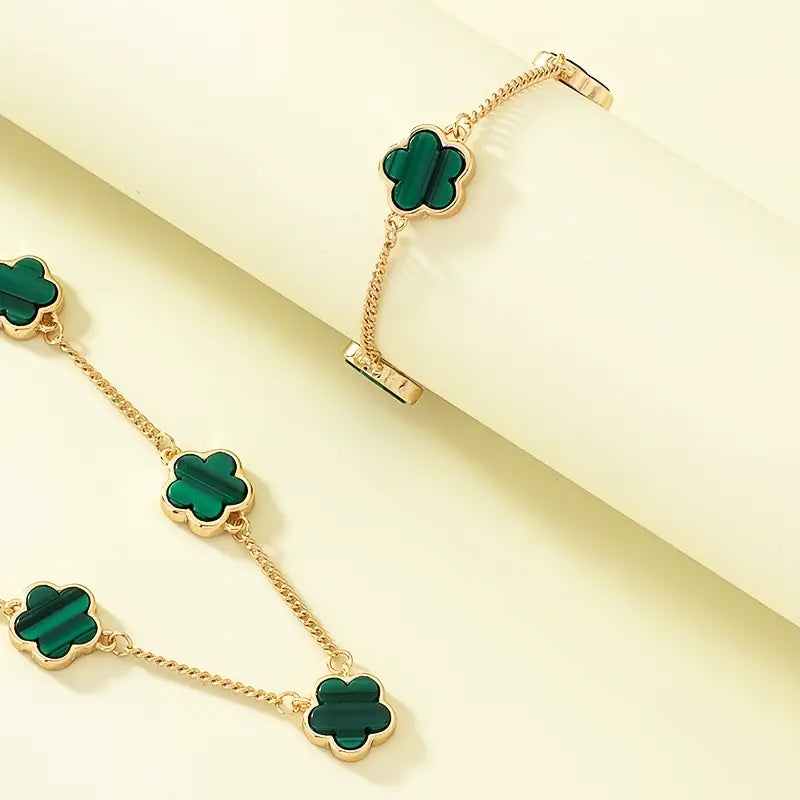 Gold-plated necklace and bracelet set with green clover flower charms