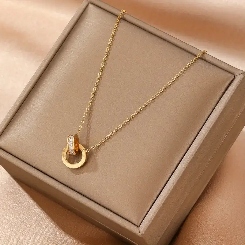 gold interlocking circle necklace with diamonds