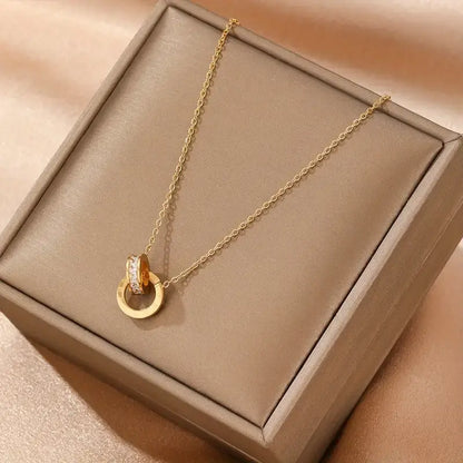 gold interlocking circle necklace with diamonds