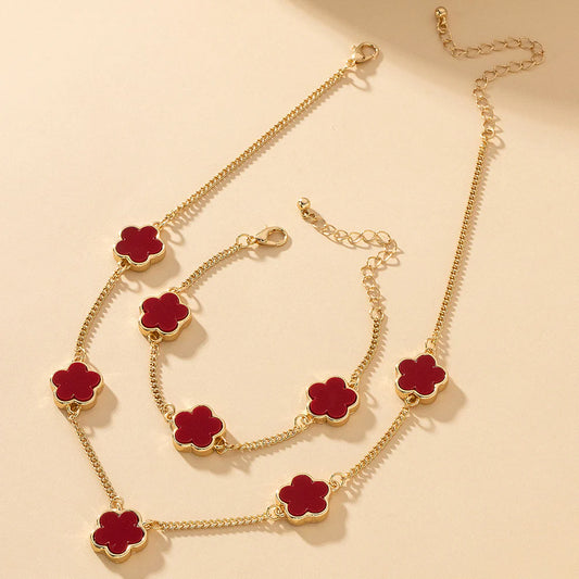 Gold-plated necklace and bracelet set with red clover flower charms