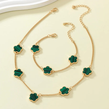 Gold-plated necklace and bracelet set with green clover flower charms